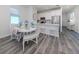 Elegant dining area with table and bench seating at 117 Clifton Way, Venice, FL 34292