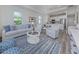 Bright living room featuring ample natural light and an open floor plan at 117 Clifton Way, Venice, FL 34292