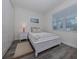 Bright bedroom with a queen-size bed and nightstands at 117 Clifton Way, Venice, FL 34292