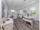Spacious living room with ample natural light and seating area at 117 Clifton Way, Venice, FL 34292