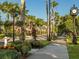 Beautiful tree-lined street with lush landscaping at 117 Clifton Way, Venice, FL 34292
