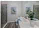 Clean bathroom with a walk-in shower and modern fixtures at 117 Clifton Way, Venice, FL 34292