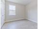 Spacious bedroom featuring light grey tile floors at 1970 Blackwood Cir, North Port, FL 34286