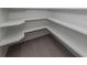 Built-in corner pantry shelves offer ample storage space at 1729 Lugano Cir, Nokomis, FL 34275