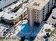 Aerial view of a condo building with multiple pools and beach access at 1255 Tarpon Center Dr. # 505, Venice, FL 34285