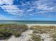 Scenic beach access with sandy path and ocean views at 1255 Tarpon Center Dr. # 505, Venice, FL 34285