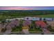 Houses on the lake at sunset, golf course in background at 1051 Creek Nine Dr, North Port, FL 34291