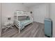 Bedroom with a white bunk bed and light blue accents at 922 E Venice Ave, Venice, FL 34285