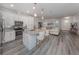 Open concept kitchen with island, granite countertops and stainless steel appliances at 922 E Venice Ave, Venice, FL 34285