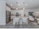 Modern kitchen with white cabinets, granite countertops, and stainless steel appliances at 922 E Venice Ave, Venice, FL 34285
