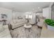 Spacious living room with beige sofa and light decor at 922 E Venice Ave, Venice, FL 34285
