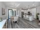 Open dining area with wood table and access to kitchen at 922 E Venice Ave, Venice, FL 34285