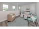 Bright bonus room with comfy seating area, perfect for relaxation at 922 E Venice Ave, Venice, FL 34285