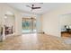 Bright and airy living room with tile floors and a view of pool at 4288 Platt St, North Port, FL 34286