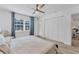 Main bedroom with large closet, ceiling fan, and view to other rooms at 18091 Eau Gallie Cir, Port Charlotte, FL 33948