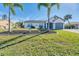 Newly renovated home with a well-manicured lawn at 18091 Eau Gallie Cir, Port Charlotte, FL 33948