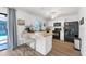 Modern kitchen with white cabinets and butcher block counters at 18091 Eau Gallie Cir, Port Charlotte, FL 33948