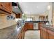 Gourmet kitchen with granite countertops, modern appliances, and ample cabinet space is great for cooking at 11065 Barnsley Dr, Venice, FL 34293