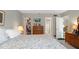 Large bedroom with king bed, dresser, and access to bathroom and closet at 244 Saint Augustine # 303, Venice, FL 34285
