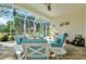Relaxing screened lanai with outdoor furniture at 11065 Barnsley Dr, Venice, FL 34293