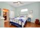 Guest bedroom with wood floors and a comfortable bed at 11065 Barnsley Dr, Venice, FL 34293