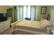 Bright bedroom with a king-size bed and ample closet space at 101 Natures Way # 1104, Rotonda West, FL 33947