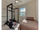 Bedroom with a full bed, home gym and window at 20625 Romagna Pl, Venice, FL 34293