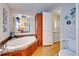 Bathroom with large corner tub and additional storage at 3100 Goldfinch Ter, Englewood, FL 34224