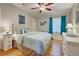 Bedroom with coastal decor, ceiling fan, and ample space at 3100 Goldfinch Ter, Englewood, FL 34224