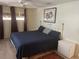 Bedroom featuring a bed, an art print, and wood-look flooring at 517 Via Veneto, Venice, FL 34285