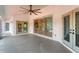 Bright screened porch with access to the backyard and interior at 177 Venice Palms Blvd, Venice, FL 34292