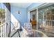 Private balcony with outdoor furniture offering a relaxing space at 454 Cerromar Rd # 275, Venice, FL 34293