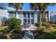 Two-story building with light blue exterior and staircase at 454 Cerromar Rd # 275, Venice, FL 34293