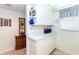 White cabinets and countertops, open shelving, and ample storage space at 454 Cerromar Rd # 275, Venice, FL 34293