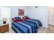Guest bedroom with two twin beds and updated flooring at 454 Cerromar Rd # 275, Venice, FL 34293