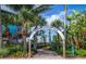 Archway entrance to Venice Fishing Pier with tropical plants at 454 Cerromar Rd # 275, Venice, FL 34293