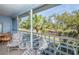 Relaxing screened balcony overlooking lush greenery at 454 Cerromar Rd # 275, Venice, FL 34293