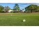 View of the golf course with houses in the background at 454 Cerromar Rd # 275, Venice, FL 34293