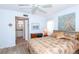 Main bedroom with ensuite bathroom access and ceiling fan at 454 Cerromar Rd # 275, Venice, FL 34293