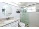 Clean bathroom with shower, granite vanity, and updated fixtures at 454 Cerromar Rd # 275, Venice, FL 34293