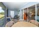 Relaxing screened balcony with seating area and view at 454 Cerromar Rd # 275, Venice, FL 34293