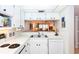 White kitchen features double sink, stove and dishwasher at 454 Cerromar Rd # 275, Venice, FL 34293