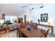 Spacious dining area with living room view and wood flooring at 454 Cerromar Rd # 275, Venice, FL 34293