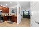 Modern kitchen with dark wood cabinets and stainless steel appliances at 20392 Lagente Cir, Venice, FL 34293