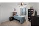 Bright bedroom featuring a rustic wood headboard and shelving at 20392 Lagente Cir, Venice, FL 34293