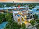 Aerial view of a luxurious condo with a rooftop pool and solar panels at 361 Benjamin Franklin Dr # A, Sarasota, FL 34236