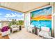 Balcony features outdoor seating with a beautiful ocean view and colorful mural at 361 Benjamin Franklin Dr # A, Sarasota, FL 34236