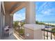 Balcony view of beach and city with seating at 361 Benjamin Franklin Dr # A, Sarasota, FL 34236