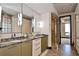 Bathroom with granite countertops, a seamless glass shower, and modern fixtures at 361 Benjamin Franklin Dr # A, Sarasota, FL 34236