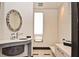 Modern bathroom with decorative mirror, sleek vanity, and stylish fixtures, offering a spa-like experience at 361 Benjamin Franklin Dr # A, Sarasota, FL 34236